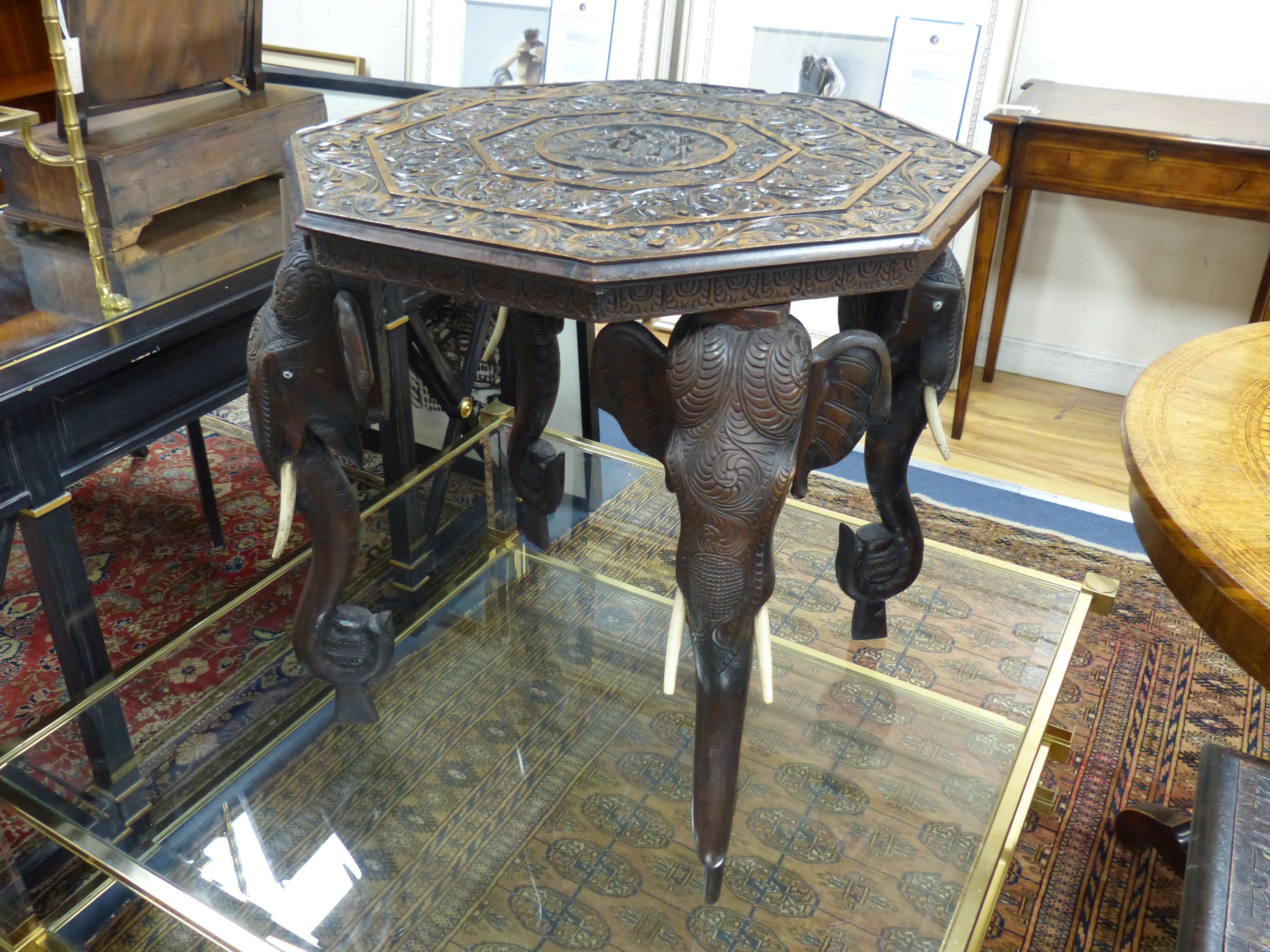 An Indian octagonal carved hardwood occasional table, width 53cm, depth 53cm, height 62cm
